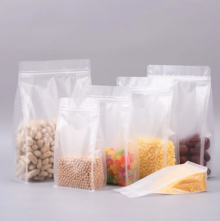 Op maat gemaakte platte bodem achtzijdige afdichting helder doorzichtig zip slot droog fruit voedsel rijst verpakking plastic stand up pouch